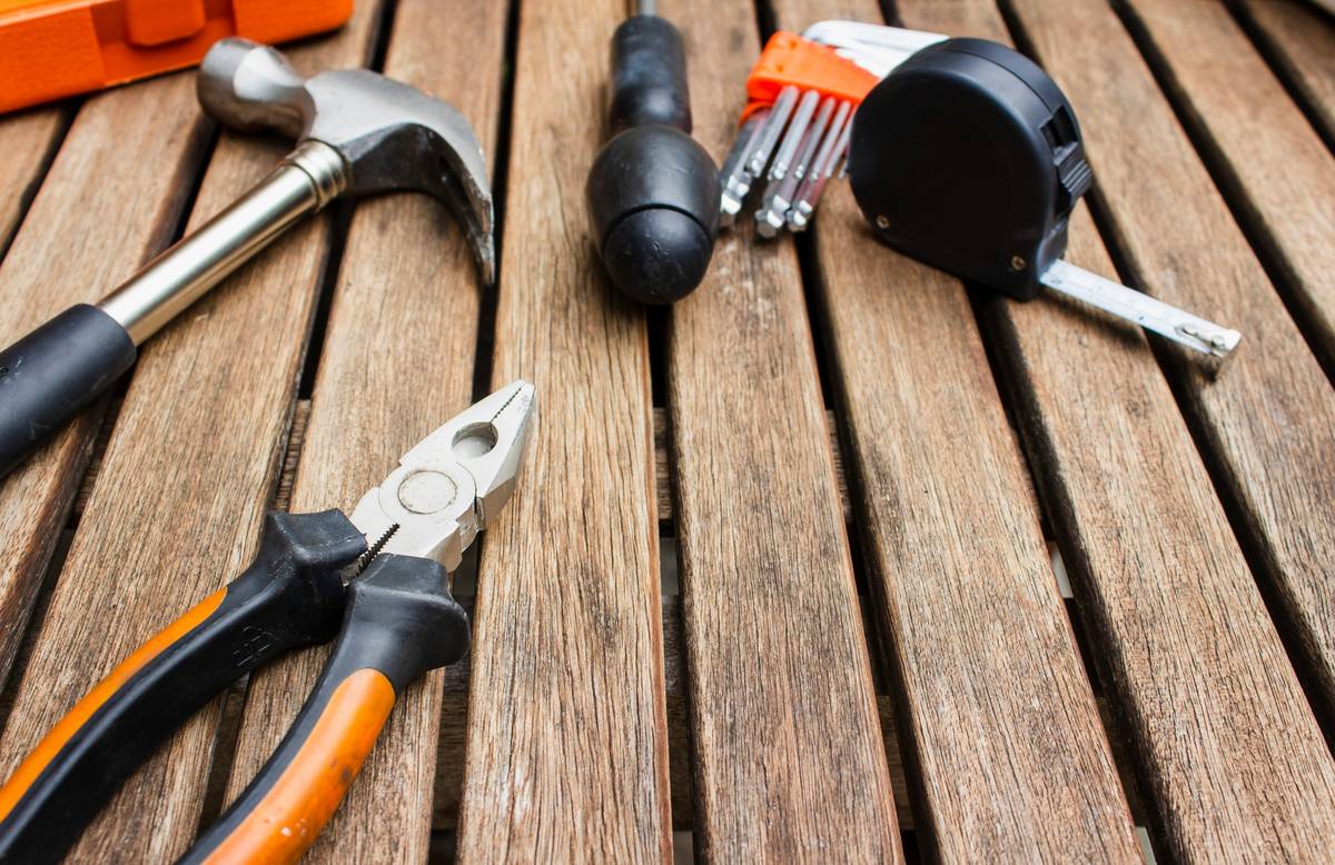 Close-up of first fix nail guns showing nail depth adjustment and magazine loading